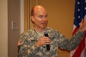 Col. David Barlow, USA, director, Fort Gordon Battle Laboratory, gives an overview of the lab at the chapter's August luncheon.